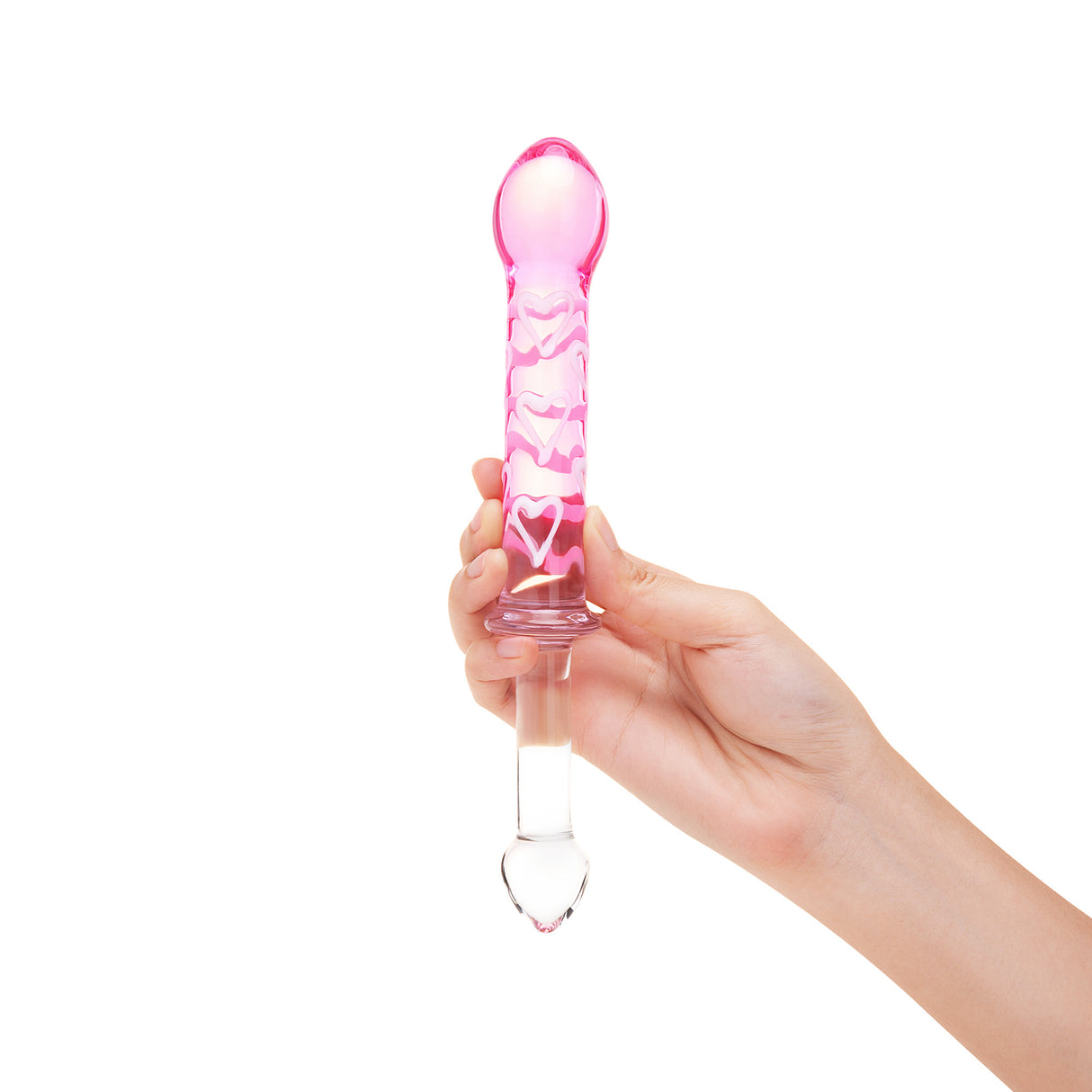 Hand holding a dual-ended glass dildo featuring a smooth end and a pink ribbed textured end against a white background