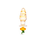 Glass anal plug featuring a rippled shaft and a jack-o-lantern pumpkin-shaped base on a white background