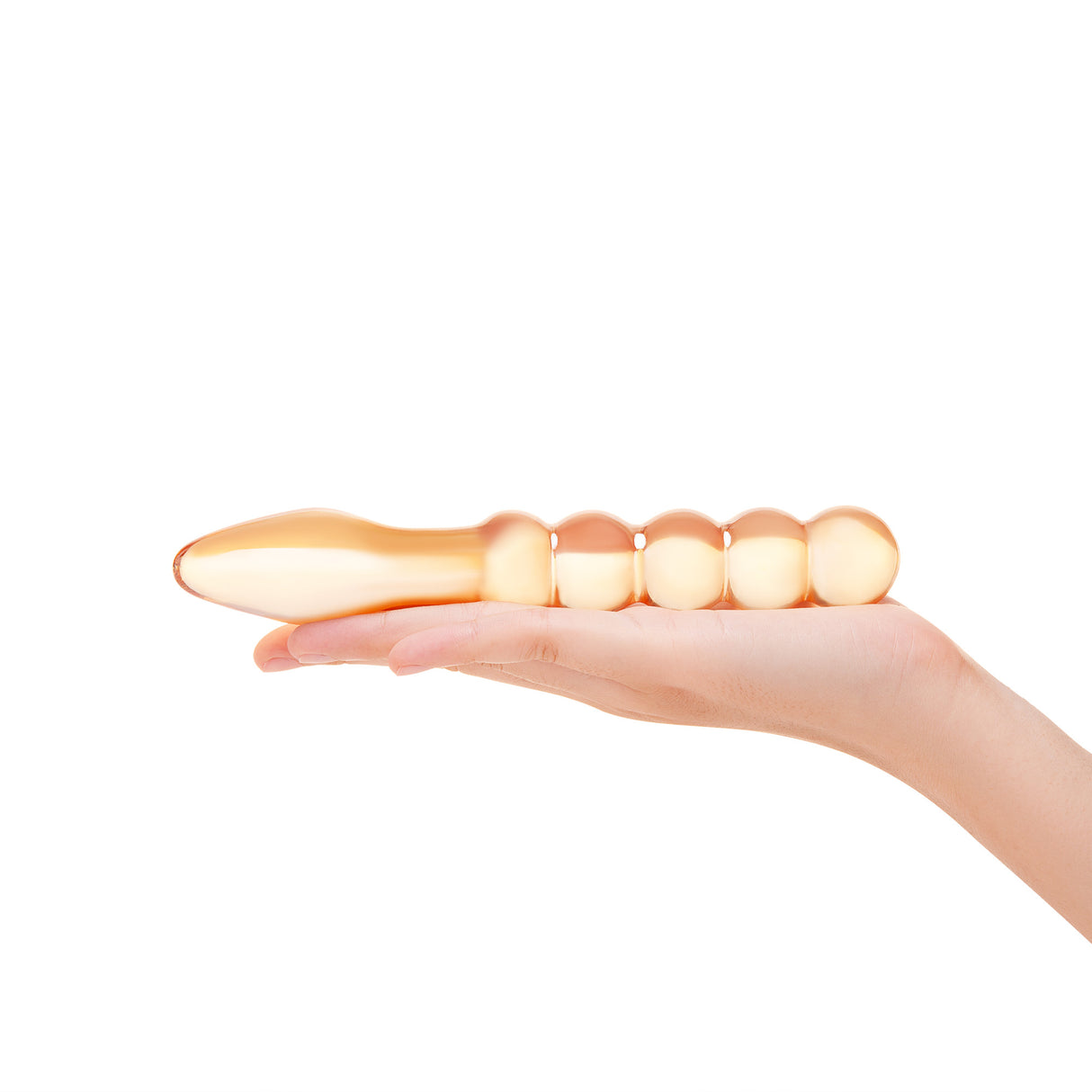 Hand holding a Dual-Ended Beaded Glass Dildo - smooth tapered end and a beaded shaft on a white background