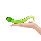 Green Nubbed Glass Dildo with a ring-shaped handle and nubbed shaft  held in a hand on a white background