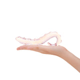 Hand holding a Nubbed glass dildo with tapered tip and ridges on a white background