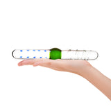 Hand holding a Dual-Ended Textured dildo with a center bulb, spiral and nub textured shaft  on a white background