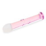 glass anal plug featuring a blush-pink shaft and frosted white tip with bubble-accented shaft on a white background