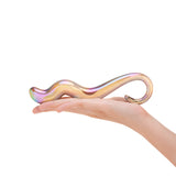 Hand holding a Holographic Glass Dildo with curvy shaft and ring handle against a white background
