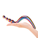 Multicolored Dual-Ended Glass Dildo with beaded and smooth ends held in a hand against a white background