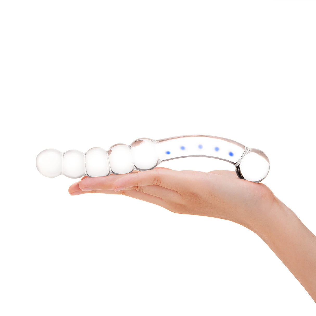 Hand holding a Dual-Ended Glass Dildo featuring blue accentsw with beaded ends and round bulb tip on a white background