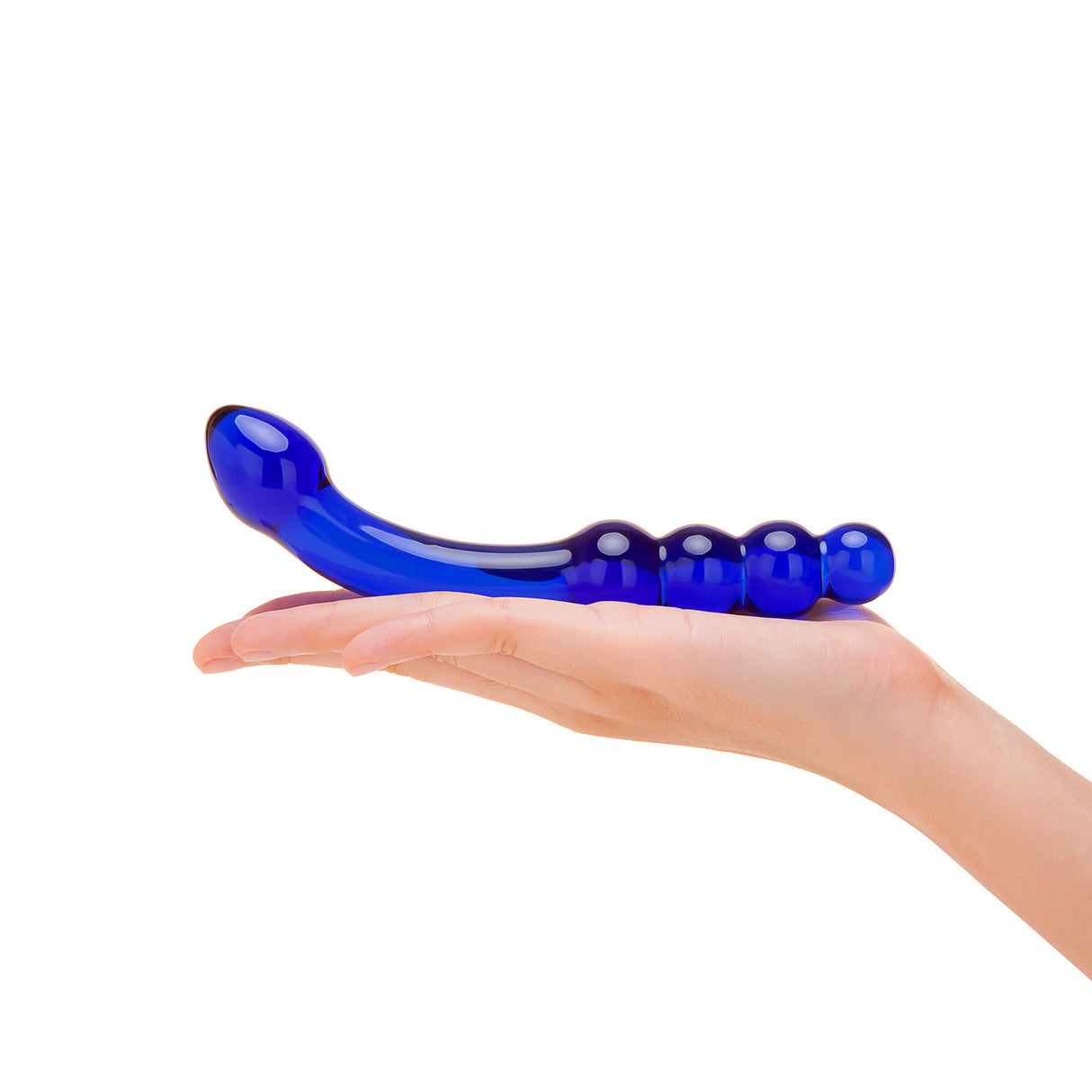 blue dual-ended glass curved dildo with graduated beads and tapered tip held in a hand on a white background