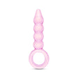 Pink glass anal plug with beaded shaft, tapered tip and ring base on a white background