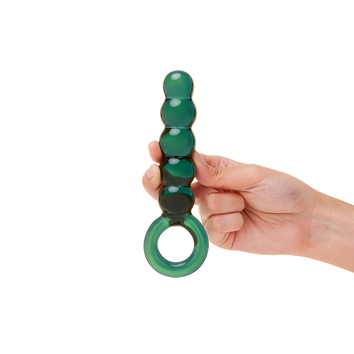 Hand holding a Green Beaded Glass Anal Plug against a white background