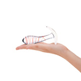 Tapered Glass Anal Plug with red stripes held in a hand on a white background