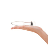 Sparkle Glass Anal Plug with tapered tip and flat, flared base in a hand against a white background