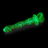 Glowing Glow-in-the-Dark Glass with a heart-shaped base on a black background