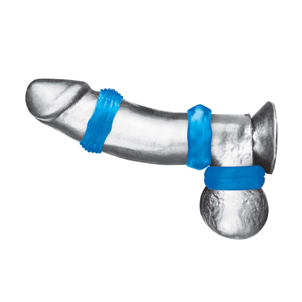 Horizontal view of dildo wearing the Blue Line 3-Pack Nuts & Bolts Stretch Cock Ring Set