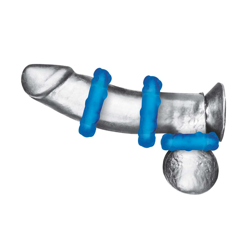 Dildo wearing the Blue Line 3-Pack Ribbed Rider Cock Ring Set