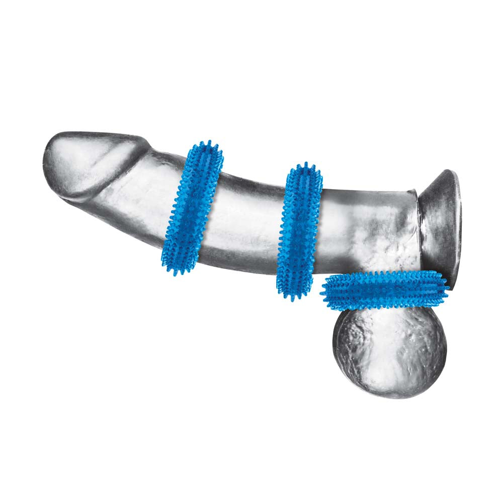 Horizontal view of dildo wearing the Blue Line 3-Pack Ultra-Stim Stretch Cock Rings