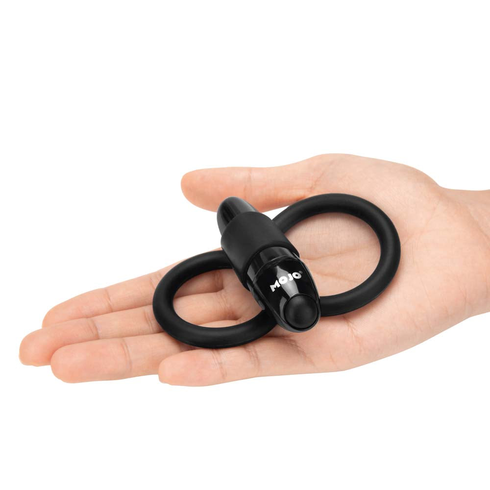 Model holding the Mojo Apeiros vibrating cock and testicles ring