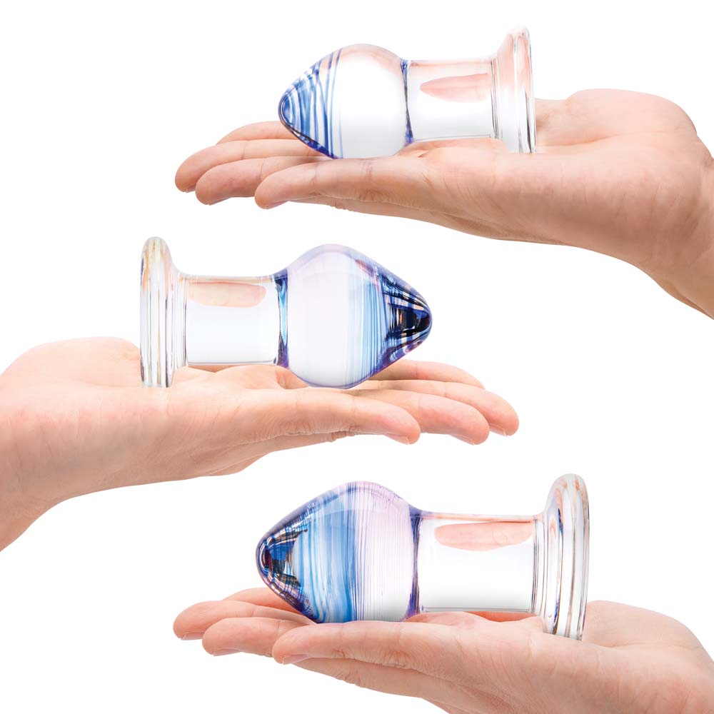 Models holding the small, medium and large size Anal Plugs as part of the Gläs Pleasure Droplets Anal Training Kit