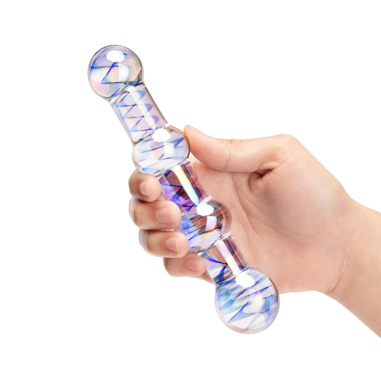 Glass dildo with a colorful design held by a hand on a white background