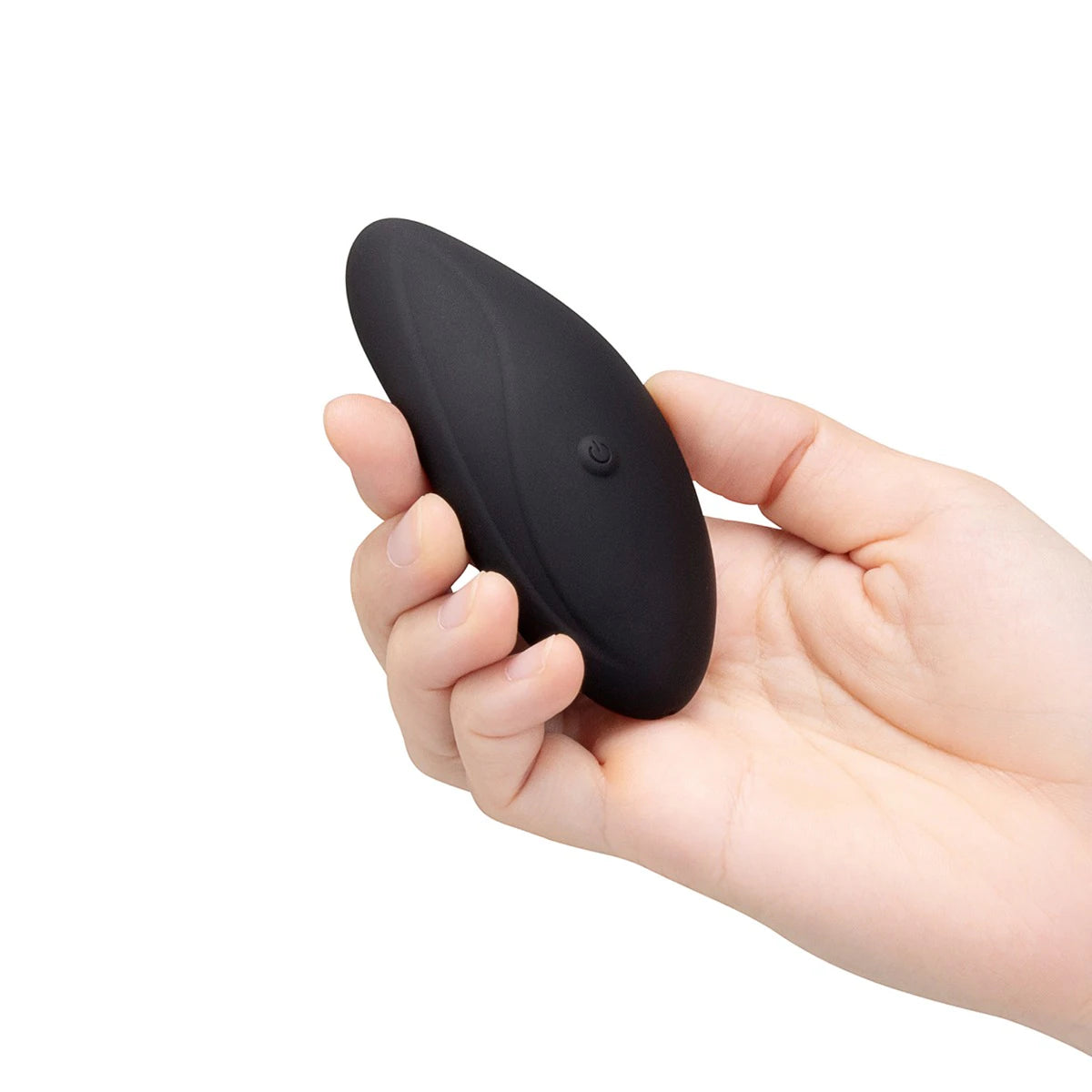 Hand holding the panty vibe and remote to provide size and scale reference.
