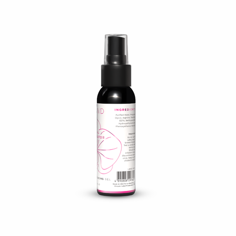 Black spray bottle with a white label on a white background