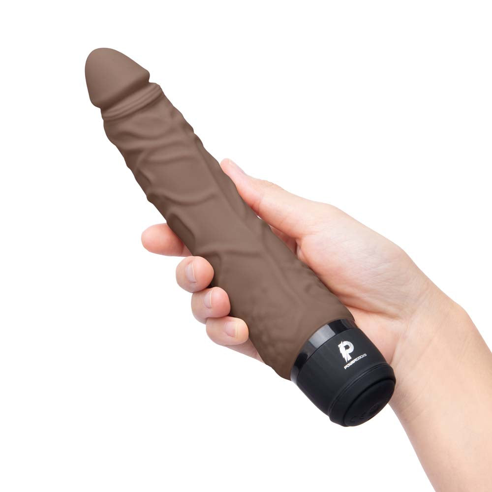 Model holding the Powercocks 7" Realistic Vibrator in Dark Brown color