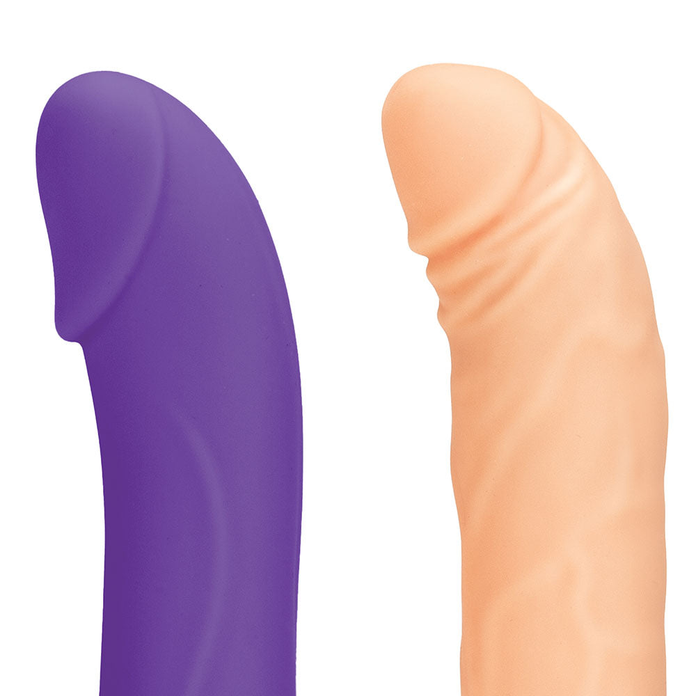 The two included life-like attachments of the Lux Fetish Thrusting Remote-Controlled Rechargeable Compact Sex Machine by Gläs