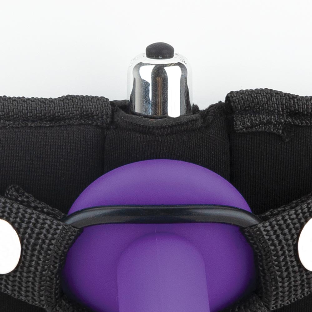 Close up view of the base of the dildo attached to the harness ring with the Lux Fetish Strap On Harness & 5 inches Dildo Set